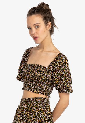 Black floral crop top with puffed sleeves, featuring a square neckline and a gathered texture. Small multicolored flowers throughout.