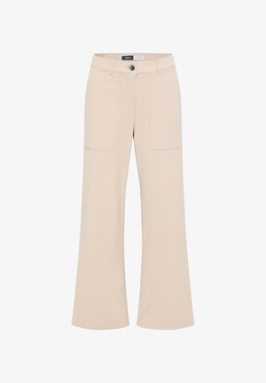Beige wijde broek gemaakt van geweven stof, met een knoopsluiting, twee frontzakken en stikdetails langs de naden.