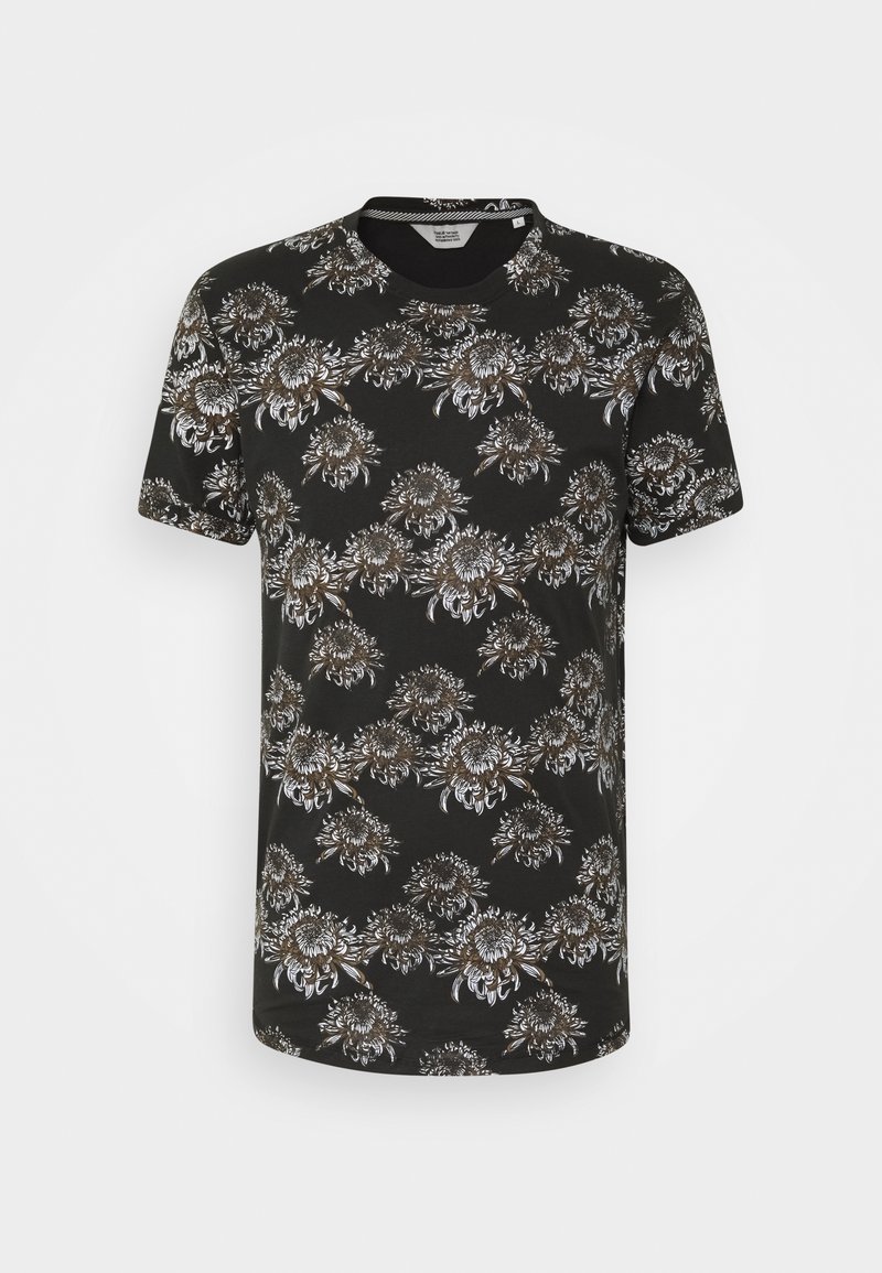 T-shirt noir à manches courtes avec un motif floral large répété en blanc et tons bruns, col rond, présenté sur un fond uni.