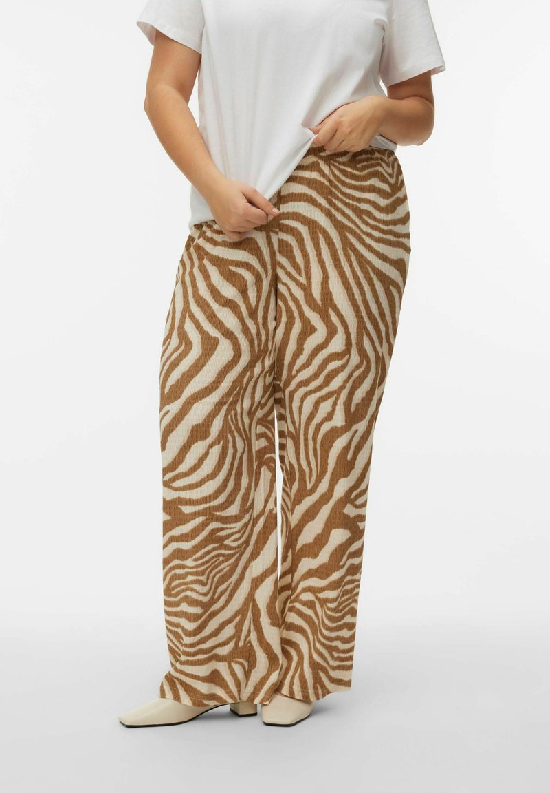 Pantalon à jambes larges avec un motif rayé zèbre, présentant des couleurs marron et beige. Fabriqué dans un tissu texturé, il possède une ceinture élastique.