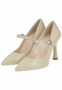 Beige High Heels mit spitzen Zehen, einem Mary Jane Riemen, glatter Lederoberfläche und quadratischem Absatz.