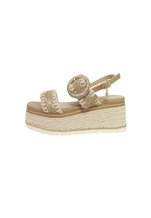 Sandali platform beige con dettagli in corda intrecciata, un'applicazione rotonda e una cinghia alla caviglia regolabile. Suola in gomma bianca spessa.