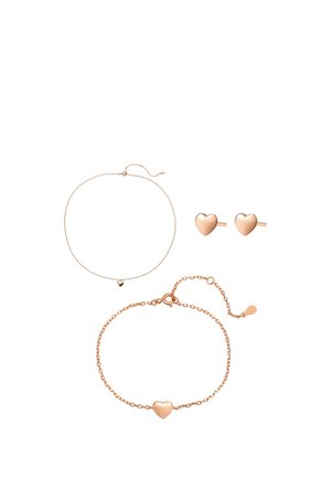 Rose gold jewelry set with heart-shaped stud earrings, a delicate heart pendant necklace, and a heart charm bracelet on a white background.