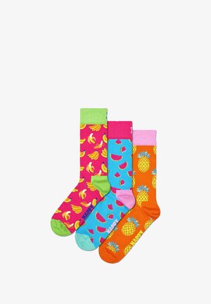 Three pairs of cotton socks featuring bright colors: pink with bananas, blue with watermelons, and orange with pineapples. Each has a contrasting cuff.