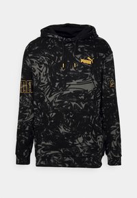 Czarna bluza z kapturem z abstrakcyjnym szarym wzorem w wir, z żółtymi akcentami logo na klatce piersiowej i rękawie, regulowany kaptur na sznurki.