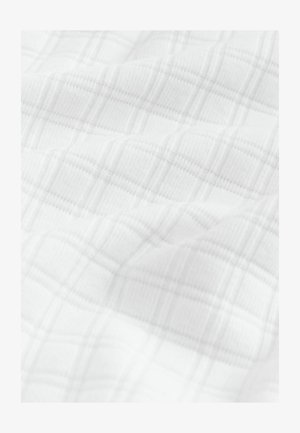 Valge kangas kerge kootud ruudustiku mustriga, millel on heledad hallid jooned. Sile tekstuur kerge läikega.