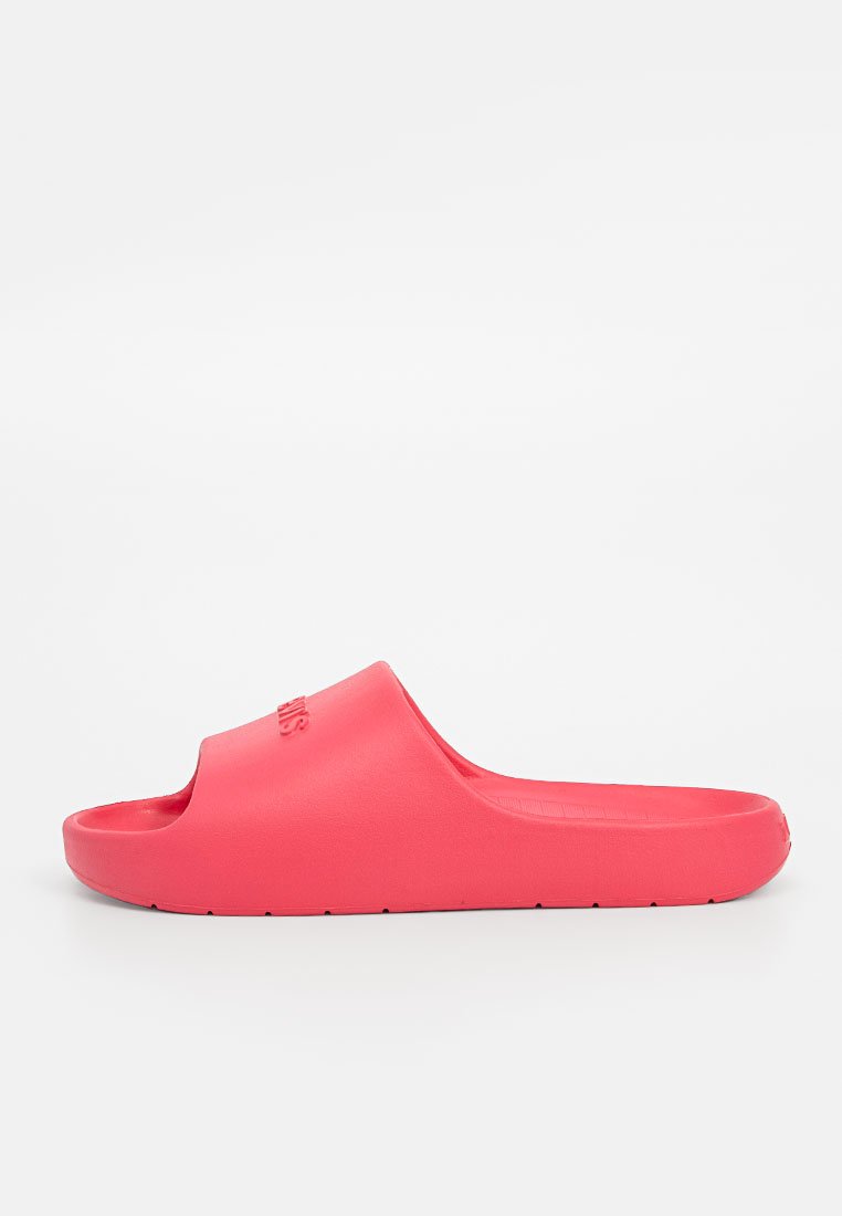 Infradito in gomma rosa con design open toe, suola piatta e soletta testurizzata. Presenta un logo in rilievo sulla cinghia superiore.
