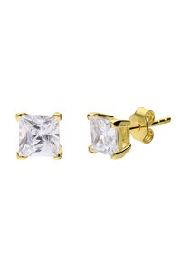 Boucles d'oreilles carrées en or avec de grandes pierres en zircon cubique transparent taillées, serties de quatre griffes. Fini poli avec un fermoir sûr.