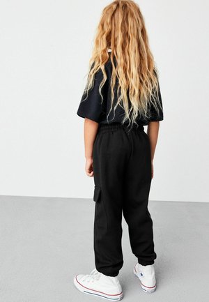 Next, Pantalon de survêtement - black