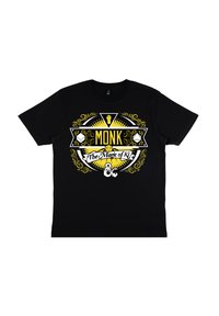 Černé bavlněné tričko s barevným grafickým designem s žlutým a bílým textem "MONK The Magic of Ki", obklopené zdobnými vzory.