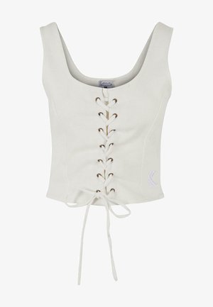 Balta trumpa palaidinė su plačiomis petnešomis, nėrinių priekis su rudojo spalvos akytėmis ir raišteliu juosmens detalėje. Minkšta medžiaga su minimalistišku dizainu.