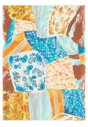 Colorful scarf with a patchwork design featuring floral and abstract patterns in blue, orange, and yellow on a light fabric. Edges are fringed.