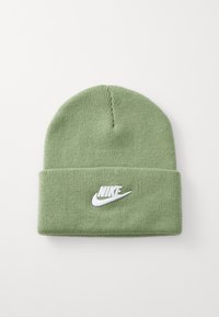 Zelena pletena kapa z belim vezenim Nike logotipom, mehak občutek in preklopni rob za dodatno toploto in stil.
