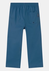 Blue waterproof pants with an elastic waistband, straight-leg design, and a single back pocket featuring a button closure.