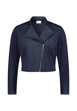 Veste cropped bleu marine en matériau doux avec un collier pointe, fermeture à glissière asymétrique et manches longues. Texture lisse tout au long.
