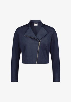 Granatowa, krótka kurtka z miękkiego materiału, z wydłużonym kołnierzem, asymetrycznym zapięciem na zamek oraz długimi rękawami. Gładka tekstura na całej powierzchni.