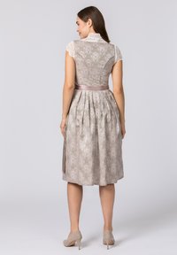 A light grey dress with lace cap sleeves, a pleated skirt, and satin waist ribbon. The fabric features an intricate floral pattern.