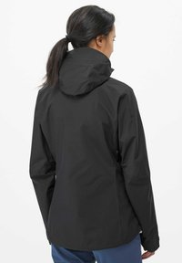 Black waterproof jacket with a hood, featuring a smooth texture and fitted design. The back showcases a clean, minimalistic look.
