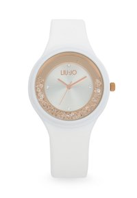 Reloj de silicona blanco con un bisel de oro rosa, acentos brillantes alrededor de la esfera y un dial minimalista que presenta manecillas y marcadores en tono plateado.