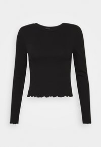 Schwarzes Langarmoberteil aus geripptem Material mit rundem Halsausschnitt und fransigem Saum am unteren Ende. Enganliegende Silhouette.