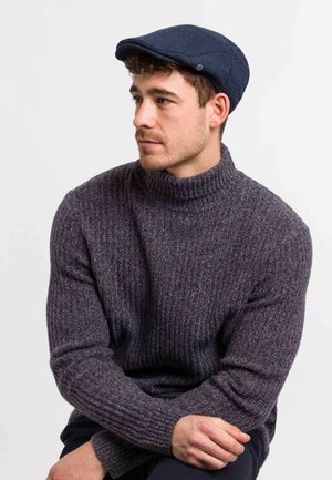 Gray ribbed turtleneck sweater and navy flat cap. Sweater features a high collar and textured knit pattern. Cap includes decorative stitching.