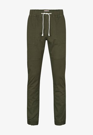 Olivgrüne Jogginghose mit elastischem Bund, weißer Kordel, aufgesetzten Vordertaschen und elastischen Bündchen an den Knöcheln. Keine Person sichtbar.