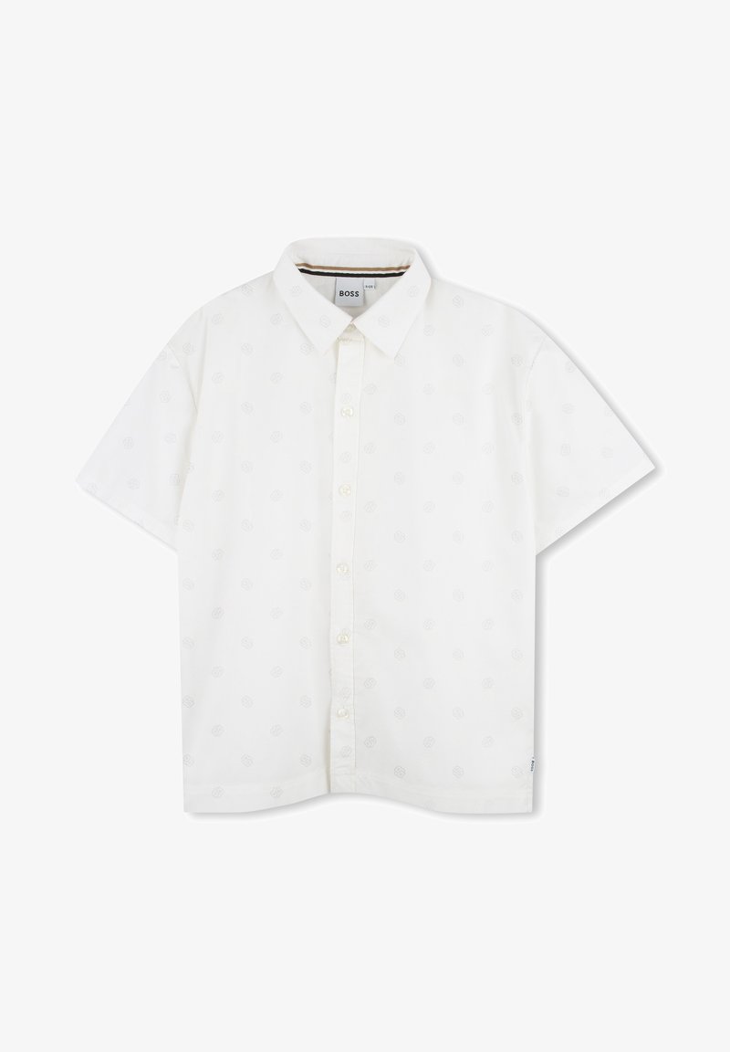 Λευκό κοντομάνικο πουκάμισο με δομημένο γιακά, με διακριτικό σχέδιο και κλείσιμο με κουμπί. Φτιαγμένο από ελαφρύ ύφασμα.