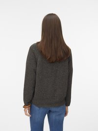 Dark gray knitted sweater with a relaxed fit, featuring ribbed cuffs and hem, paired with blue jeans. Smooth texture, simple design.