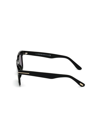 Black sunglasses with a glossy finish, rectangular lenses, gold accents on the temples, and a sleek design. Made in Italy.