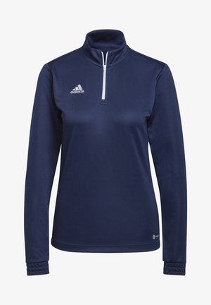 Pullover blu navy a maniche lunghe con zip a quarti, realizzato in un tessuto morbido. Presenta il logo bianco Adidas sul lato sinistro del petto e polsini con texture.