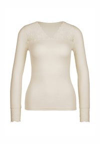 Langsleeve top in crème, met een geribbelde textuur en kantaccenten bij de V-hals en de manchetten. Stijlvol maar eenvoudig ontwerp.