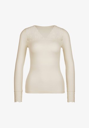 Langsleeve top in crème, met een geribbelde textuur en kantaccenten bij de V-hals en de manchetten. Stijlvol maar eenvoudig ontwerp.