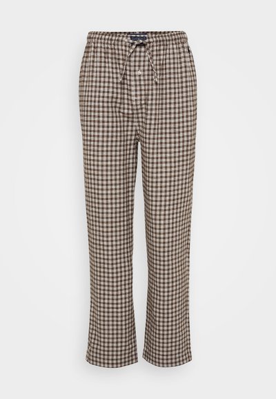 Bruine en witte geblokte broek van zachte stof, met een elastische tailleband met een trekkoord en wijde benen.