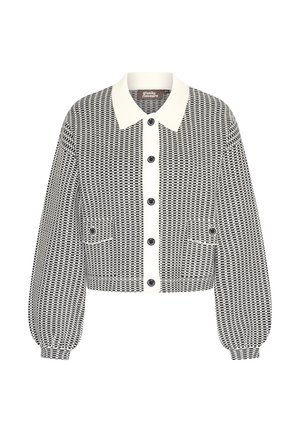 Black and white patterned cropped jacket with a cream collar, large buttons, and elasticized cuffs. Features two front pockets.