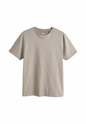 Lihtne lühikeste varrukatega beežist ümar kaelusega T-särk, mis on lahtiselt laotud, esiküljel ei ole mustreid ega logosid.