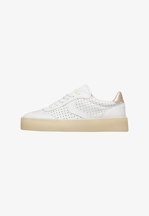 White low-top sneaker with perforated leather upper, beige sole, white laces, and metallic accent on the heel collar.
