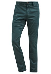 Mörkgröna chinos i bomull med smal passform, raka ben, knapp- och dragkedjestängning samt framfickor. Slät textur.