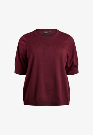 Burgundy short-sleeve knit top with a round neckline and ribbed cuffs. Soft texture and relaxed fit, featuring subtle stitching details.
