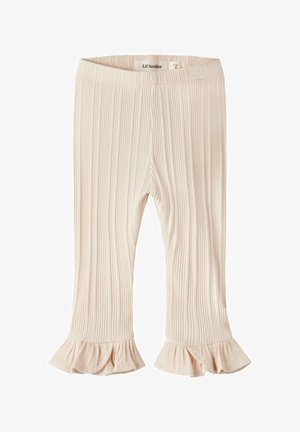 Lichtroze geribbelde legging met een uitlopende ruches aan de zoom. Gemaakt van zacht materiaal, met een elastische tailleband voor comfort.