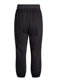 Schwarze Sporthose mit elastischem Bund und Bündchen. Hergestellt aus glattem, leichtem Material, mit einem lockeren Schnitt und ohne sichtbare Taschen.