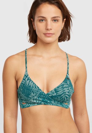 Turkio spalvos liemenėlė su gėlių raštu, plonomis petnešėlėmis, gilia V formos iškirpte ir išpjovomis juostos srityje. Pagaminta iš minkštos, tamprios medžiagos.