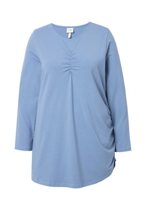 Tunic blu in cotone morbido a maniche lunghe. Presenta un dettaglio arricciato all'escursione e una vestibilità comoda con arricciature laterali.