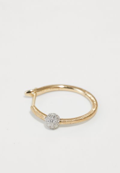 Gold hoop earring with a textured band and a round, shiny silver accent featuring small embedded stones.