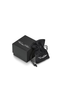 Scatola per gioielli nera con finitura liscia, dotata di un logo bianco "Thomas Sabo", accompagnata da un sacchetto in tessuto nero con coulisse abbinato.