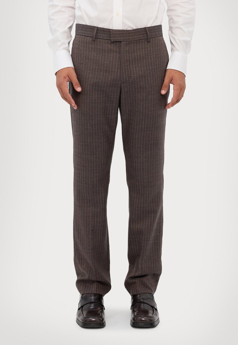 Brown striped trousers with a smooth texture, straight cut, and a standard waistband, paired with black dress shoes.
