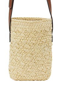 Woven straw bag in light yellow with a textured surface and brown leather strap, showcasing a cylindrical shape and open top design.