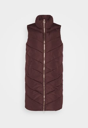 Maroon puffer vest with a high collar, zigzag quilted pattern, vertical zip closure, and two side pockets. Soft fabric with a smooth texture.