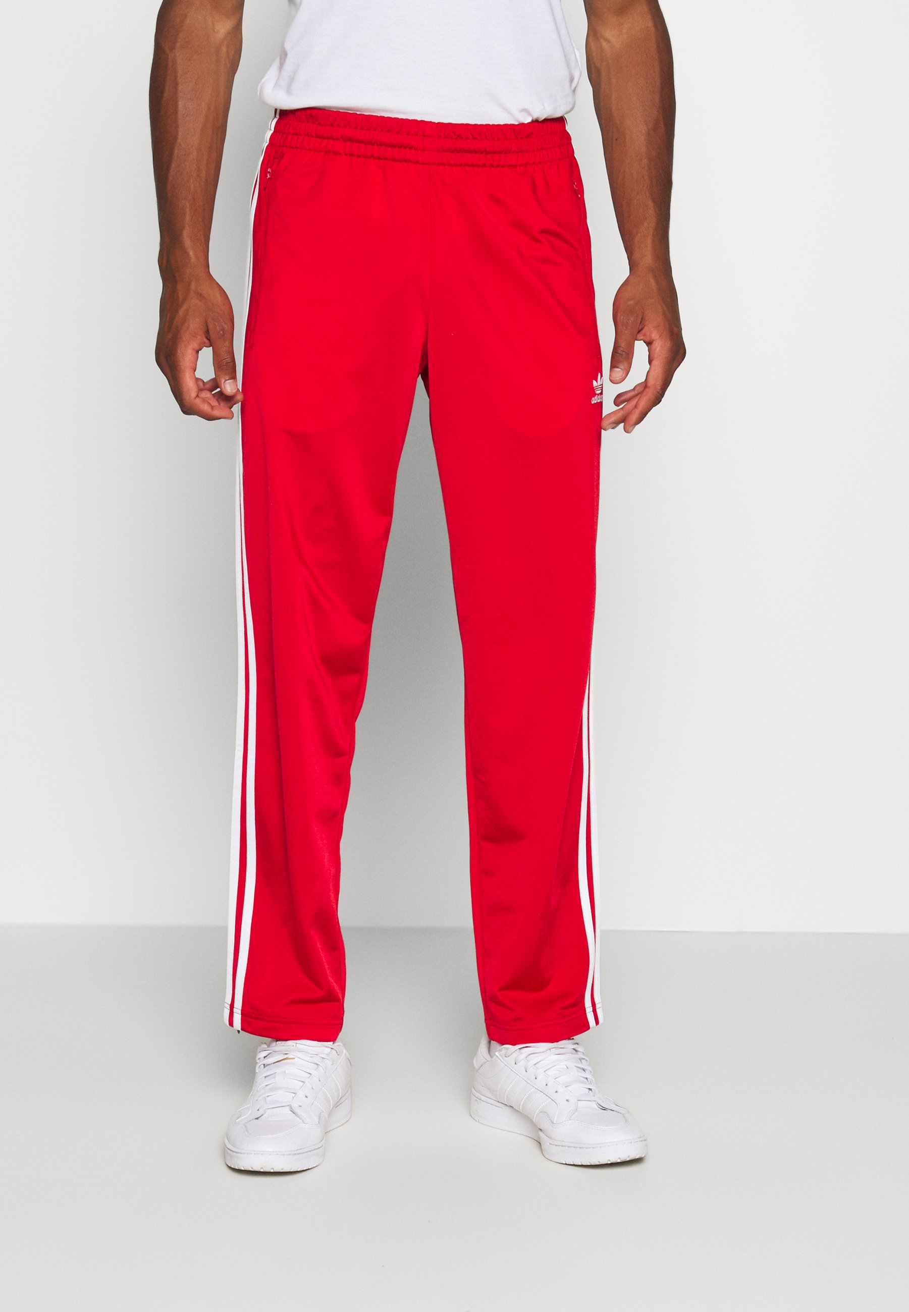 pantaloni adidas con bottoni laterali zalando