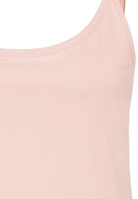 Light pink tank top made of soft cotton. Features thin straps and a rounded neckline with flat seams for a smooth finish.