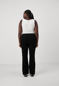 ONLY Carmakoma CARSANDRA ZIP BOX  - Alt laienevad teksad - black